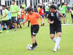 A Black Roses’ player dribbles against a Tafuna Jets’ opponen