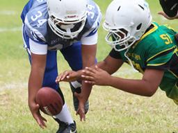 JPS Sharks punter trying to gain possession of a bad snap