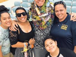 June Ifopo on graduation day with family