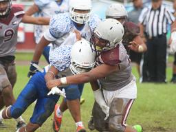 Marcus Samia hit hard by a Warrior defender
