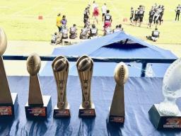 JV playing field with trophies in the foreground