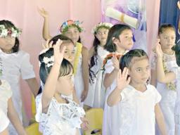 Some members of  K-5 Fatuoaiga Montessori School performing at their graduation ceremony