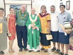 Karl Prendergast (third left) and Bishop Peter Brown (4th left) and other Holy Family parishioners 