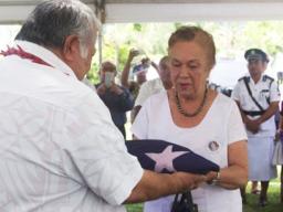 uilaepa Dr. Sa'ilele Malielegaoi presents the flag of Samoa to Celine Keil 