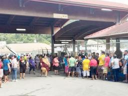 Crowds waiting for cargo off Lady Naomi 