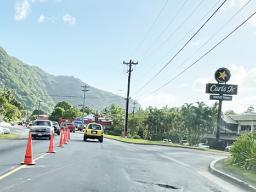 Traffic cones on road in from of CBT and Laufou