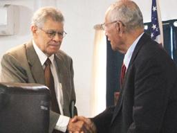 Fonoti Douglas Jessop (left) shakes hands with Sen. Soliai Tuipine Fuimaono