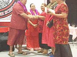 Gov Lemanu and First Lady Ella with others on stage at Faga'itua graduation