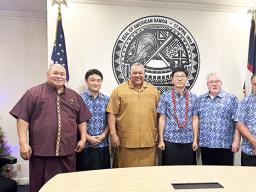 Gov. Lemanu P.S. Mauga and chief of staff with StarKist officials
