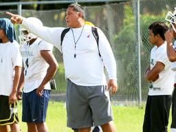 Leone Lions Head Coach, Okland Salave'a directing their strategic passing game during practice, at their school field this summer – in preparation for their game against the Vikes this Saturday. [photo: TG]