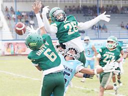 Two Leone Lions bat down the ball