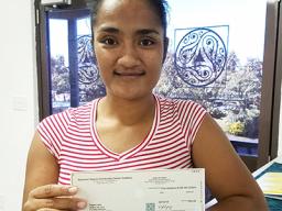Fuaao Letoi's daughter is pictured receiving Fuaao's 2nd stipend