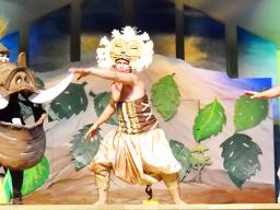 Ace Fuimaono and other actors in scene from Lion King