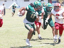 Alex Faiivae (11) of the Leone Lions returning this punt all the way to the end zone