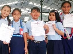 A group of bright third graders at Manumalo Academy