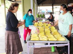 Farmer selling her produce at Fagatogo Marketplace