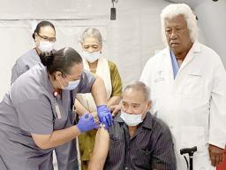 Gov. Lolo Matalasi Moliga receiving COVID-19 vaccine
