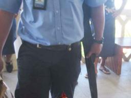 Police officers with the gun outside Samoa court