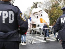 Police standing watch a day before the Thanksgiving Day parade
