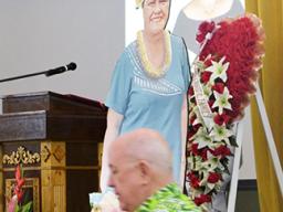  Territorial Bank of American Samoa (TBAS) president and chief executive officer David Muhler with photos of Makerita T. Polu in the background
