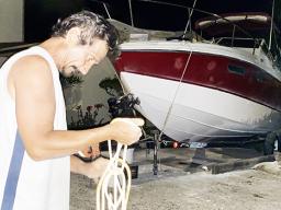 Harry Calistro Jr, ties down his 27' fishing boat