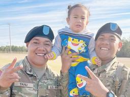 PVT Fa’amagalo Tanu and PVT Sene Jr Isileli with their nephew Jelsen