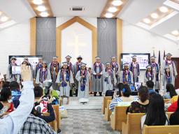 The fourteen graduates of Manumalo Academy 