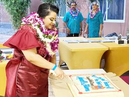 Ms. Marcella Fitisone CUTTING CAKE
