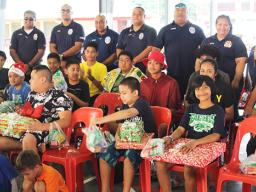 Marine Patrol members with Matafao students