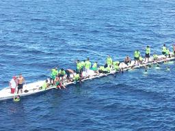 The Matasaua crew awaiting help to arrive after their fautasi took on water last Saturday