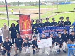 American Samoa little league players with McDonald's sign