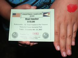 young girl with meal ticket