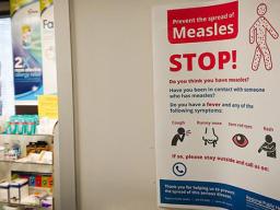 Poster warns against the spread of measles.