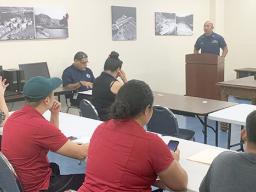 US Coast Guard Lt. Creighton C. Chong at the podium.