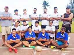 The men's rugby team poses for a group photo. 