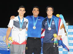 Micah Masei with Tasi Limtiaco of the Federated States of Micronesia (center) and silver medalist Alexandre Gane of New Caledonia