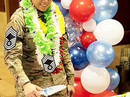 Chief Master Sergeant Jacinta Migo cutting her cake