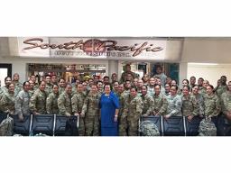 Amata with troops at airport