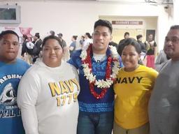 John Leulu with his parents and siblings