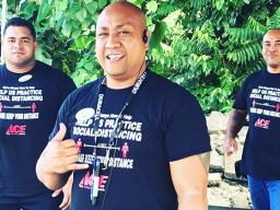 Three Neil’s ACE Home Center employees wearing social distancing t-shirts