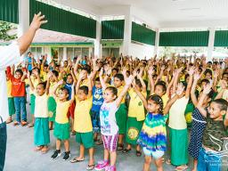 Students at Lauli`i Elementary School with a NMSAS staff member