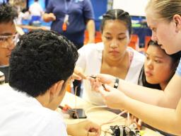 Pictured are some students from Samoana HS getting advice from a visiting Michigan student on starting their own underwater robotics teams.