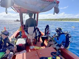 NOAA Ship Rainier crew in dingy prpeparing to dive