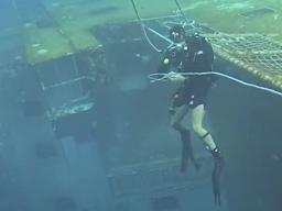 Diver on sunken ship