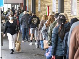 Shoppers lineup in Auckland at beginning of lockdown