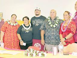 Oakie Salave’a after signing letter of intent with supporters and parents