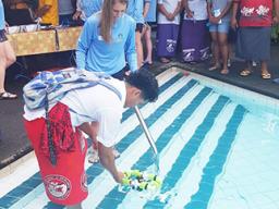 OJ Bartley of Faga'itua High School getting his hands and feet wet