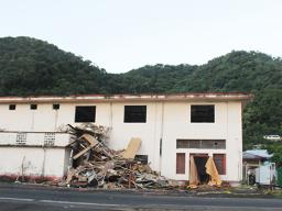 Old ASTCA building in Fagatogo with debris from demolition