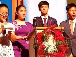 Pictured is Katherine Kim (on the mic) and three of her peers: Michelle Lo, Heyao Yang, and Victor Chen. 