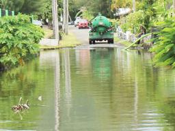 Pumper truck pumping out water at Fatuoaiga/Ottoville road
